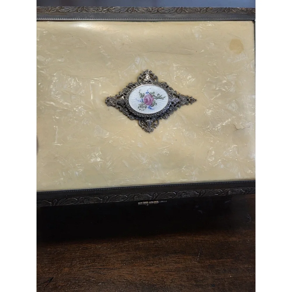 antique etched brass trinket box features a hinged lid Music Box